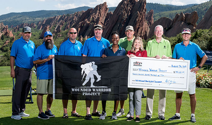 Corporate partner DCP Midstream presenting a donation check to Wounded Warrior Project teammates at the DCP National Charity Golf Tournament
