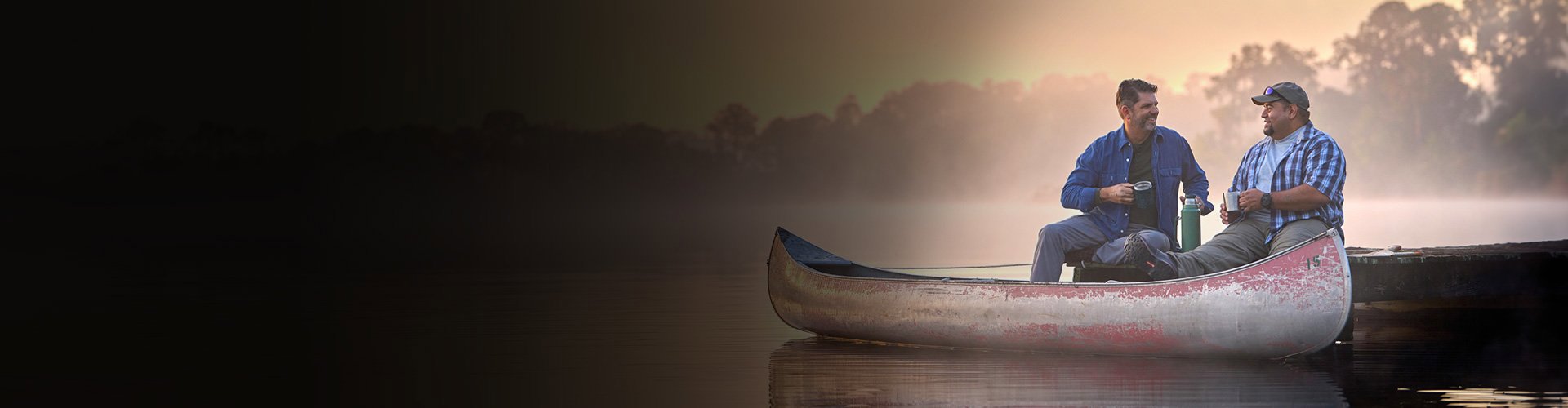 Tim Aponte - veteran and warrior sitting and talking in a canoe.