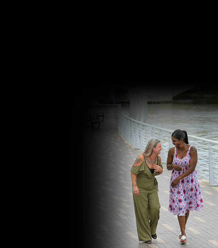 Wounded warriors Jessica Coulter and Tonya Oxendine walking together by the water