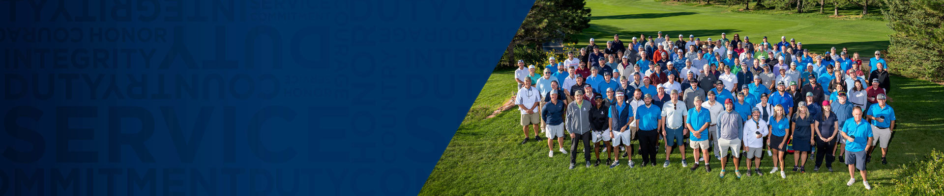 A large group of people pose for a photo during a community partner event at Arrowhead Golf Club in Littleton, Colorado.