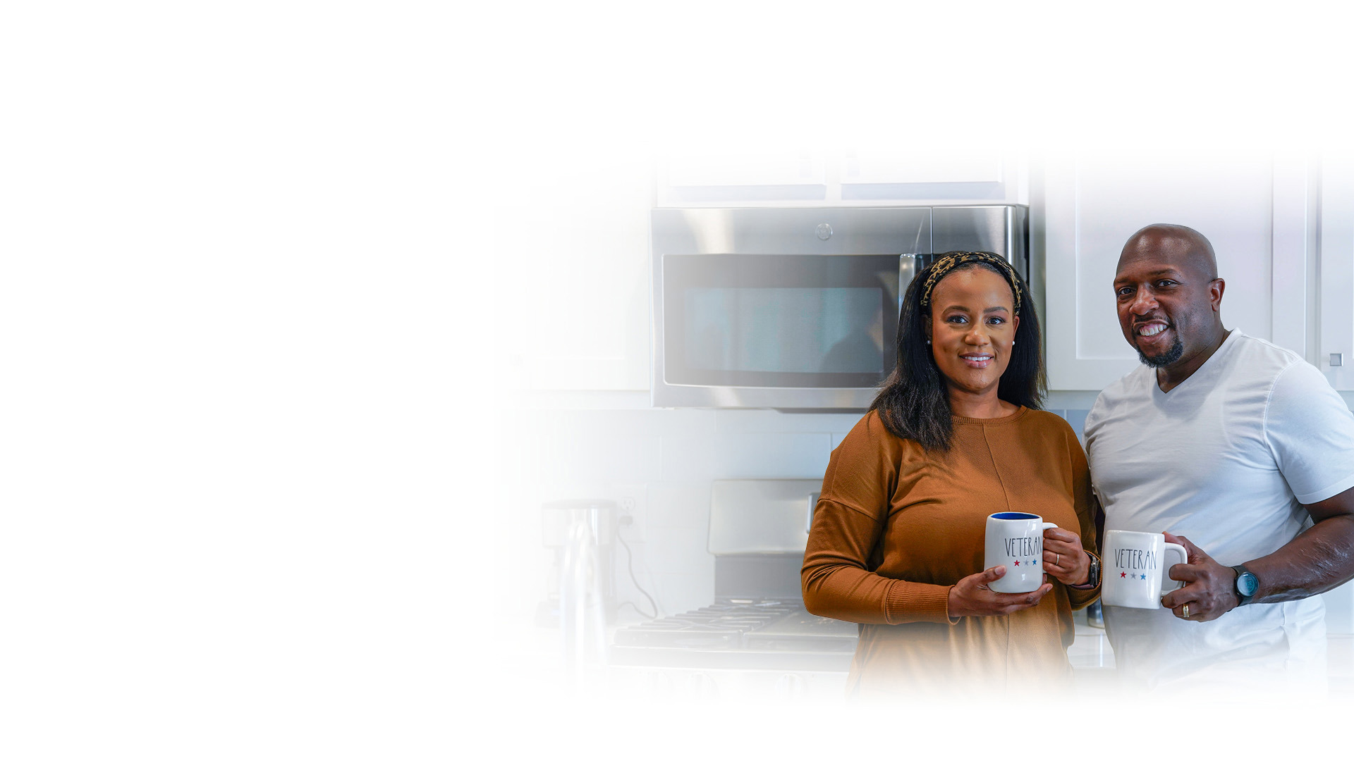 Wounded warrior Melvin Gatewood and his wife, Shalonda, standing in their kitchen drinking coffee.