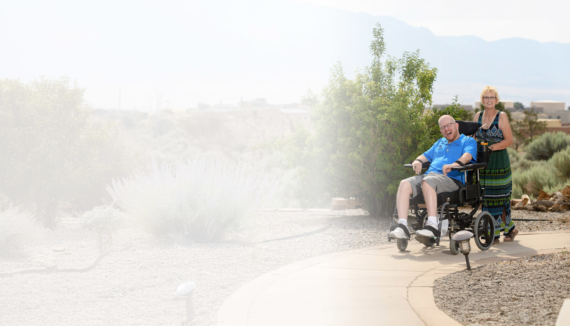 Christine Schei pushes her son wounded warrior Erik Schei, who is seated in his wheelchair